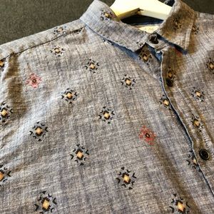 Sovereign Code medium Navy blue patterned shirt.